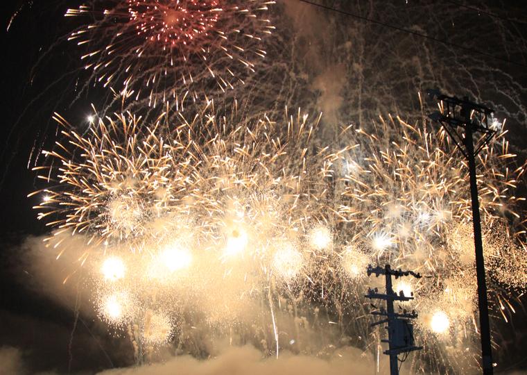 A ground-level finale lighting up the show site