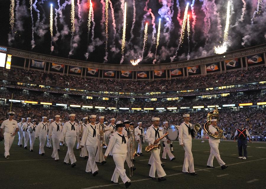 Fireworks firing across a packed stadium